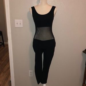 Black workout leotard with mesh middle